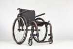 A Tsunami ALX wheelchair featuring a black seat and large wheels on a plain background.