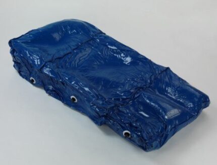 A blue waterproof cover with eyelets for securing, folded and displayed flat.