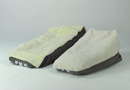 Two wedge cushions with sheepskin covers in small and large sizes, displayed side by side.