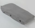 Grey protective cover designed to fit over outdoor furniture, featuring securing buttons.