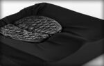 Black cushion featuring a contoured support surface designed for comfort.