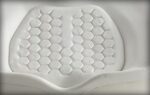 Close-up view of a white viscoelastic material featuring a honeycomb pattern.