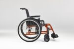 Side view of a manual wheelchair featuring an orange frame and black seat.