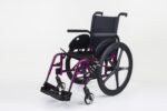 Lightweight wheelchair with a purple frame and black seat, featuring footrests and large rear wheels.