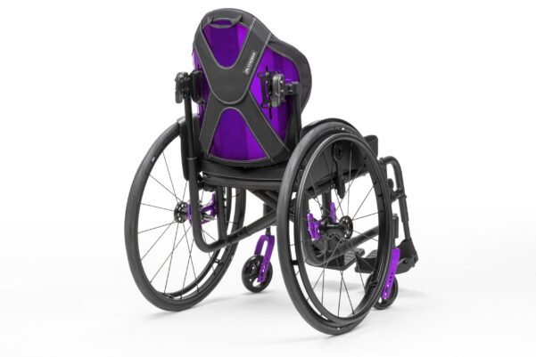 Image: a purple backrest for a wheelchair mounted on a manual high performance lightweight wheelchair