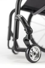 Close-up of the front wheel and frame of a Rogue New Backrest RP Tuning wheelchair.