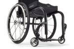 Black wheelchair with a new backrest design and large rear wheels.