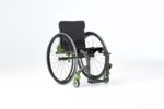 Rogue XP wheelchair featuring a charcoal grey frame with green accents and a black seat.