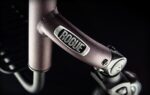 Close-up of a Rogue fitness equipment handle featuring the brand logo on a metallic surface.