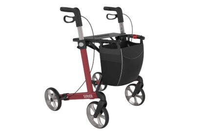 Red mobility walker with a black storage bag and four wheels, viewed from the front right.
