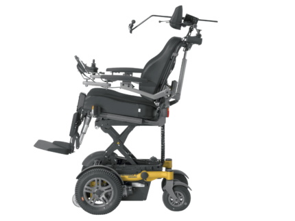 Side view of an electric wheelchair featuring an adjustable seat height and control panel.