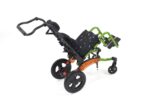 A child mobility stroller with a green and black design, featuring large wheels and adjustable seating.