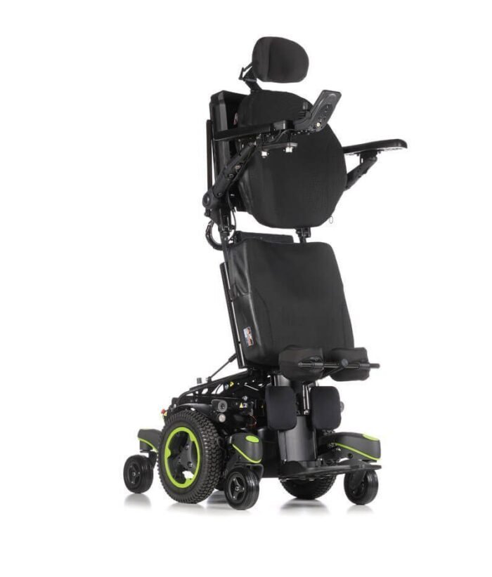 Quickie Q700 Electric Standing Wheelchair in black with lime green accents, showing that a wheelchair user could, if suited to them, stand with assistance