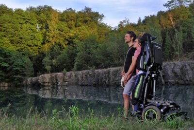 Image: a couple enjoying the view while one uses a Quickie Q700 Up M standing wheelchair