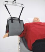 Arm lifting support sling attached to a patient model in a healthcare setting.
