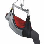 Bariatric deluxe long tucks sling with a person being lifted by a hoist system.