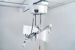 M-Series bariatric medical equipment with adjustable arms and control panel.