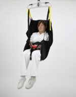 A patient lifting sling with a seated user, suspended in a neutral setting.