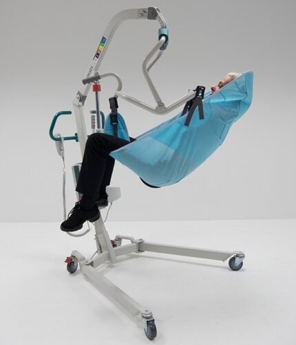 Patient lifting hoist with a blue sling and a person seated in it, positioned for lifting.
