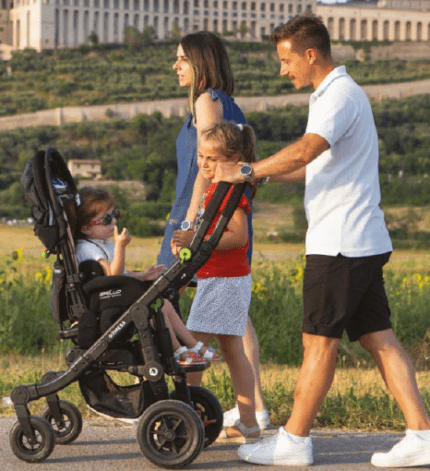 A family take their disabled child for a walk using the Ormesa Grillo